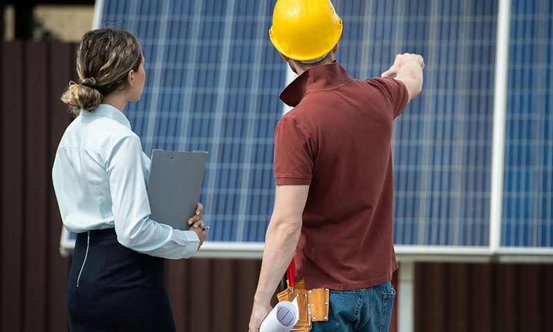 contractor-showing-installed-solar-panels-2021-09-24-03-45-07-utc